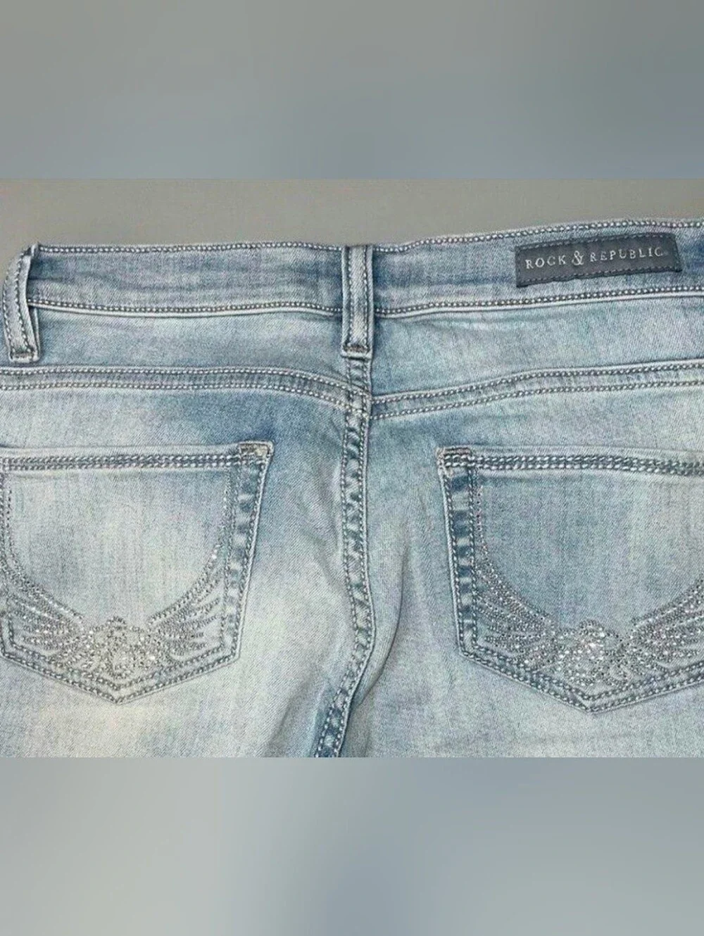 Rock & Republic Light Blue Jean Capris with Rhinestone Wing Pockets.